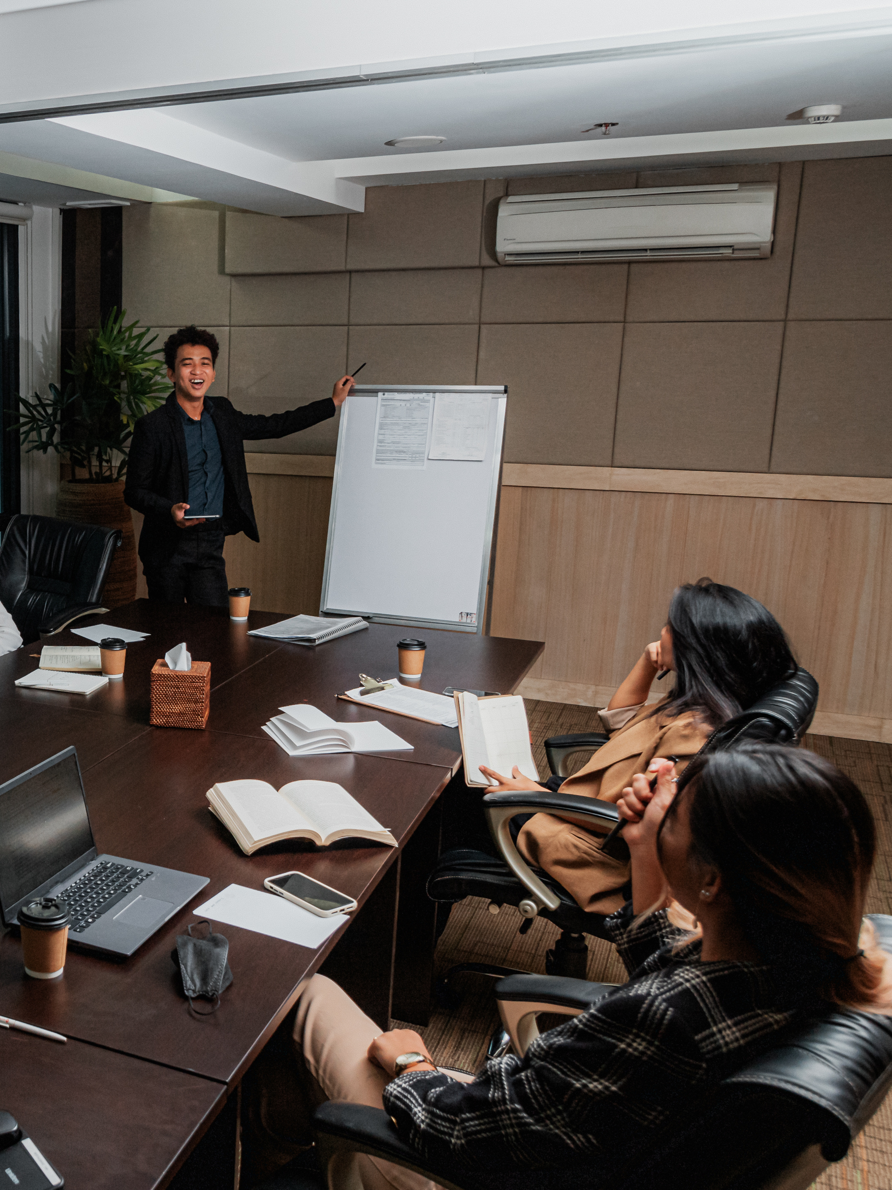 an office meeting where a person is presenting